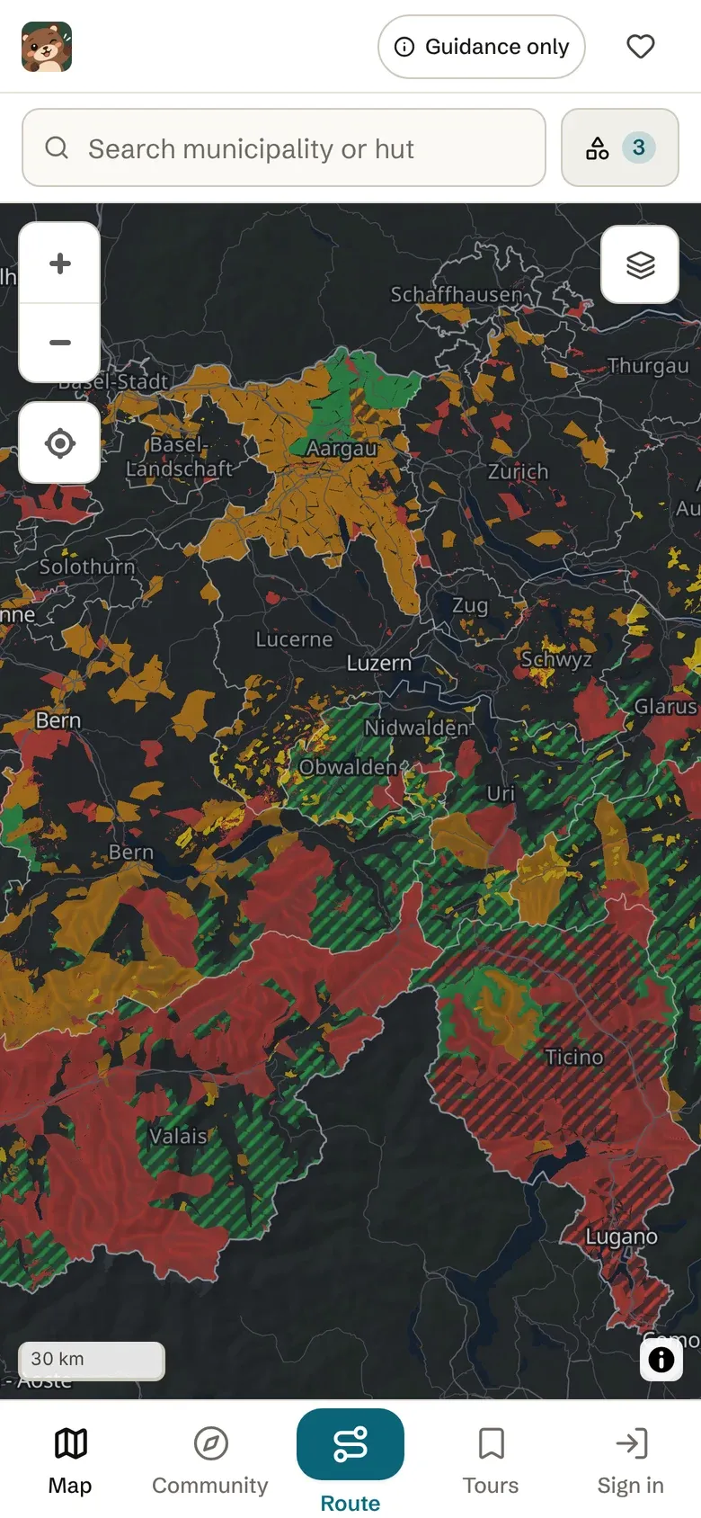 Munggi app on a phone: map of Switzerland with coloured areas.